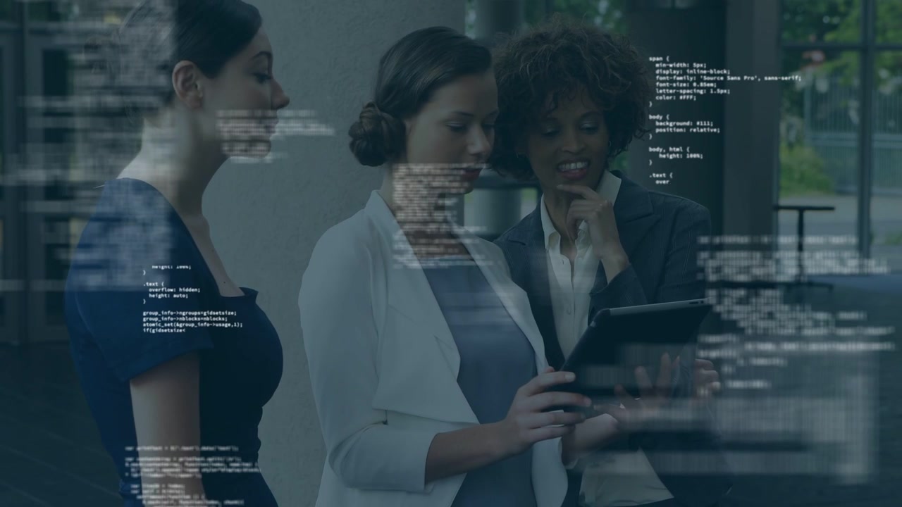 Center woman tapping tablet, causing faint code overlay, team pointing, leaning, reviewing tech
