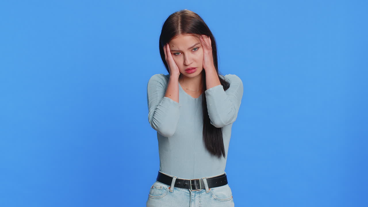 Young woman rubbing temples to cure headache problem suffering from tension and migraine stress pain