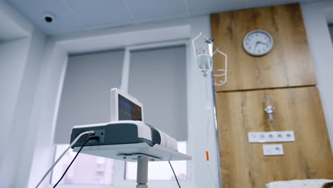 new compact cardiograph working in the hospital ward. equipment for heart examination low angle view.