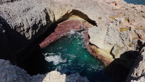 A-rock-pool-filled-with-turquoise-water-on-Island-of-Mallorca,-Spain,-creating-a-natural-oasis-of-tranquility