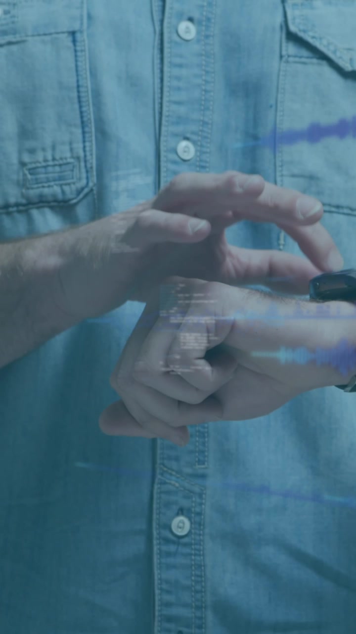 Animation of data processing on digital screen over midsection of caucasian man using smartwatch