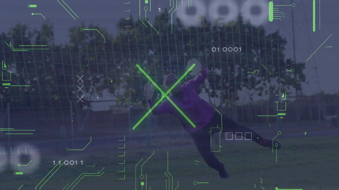 Teenage male goalkeeper standing on sports training field, showing digital overlay icons and stats