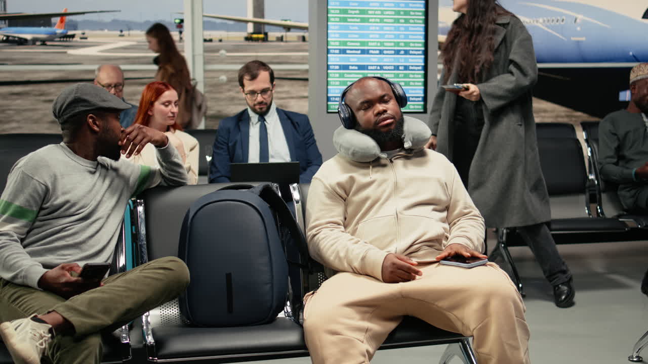 Listening music, smartphone and relaxed man in airport going to sleep