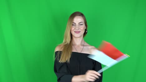 blonde woman waving in front of indonesian flag green screen