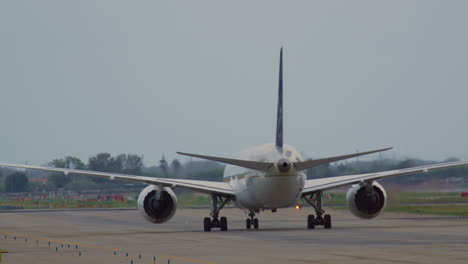 airplane taxiing on runway