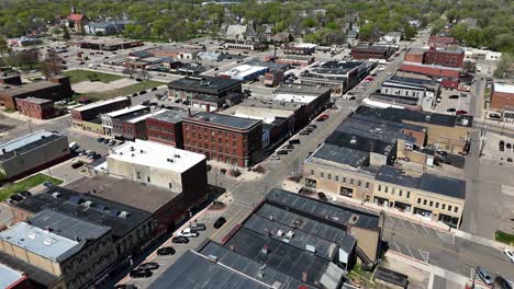 drone panning around downtown faribault minnesota, mid day early spring. historic downtown with rustic buildings