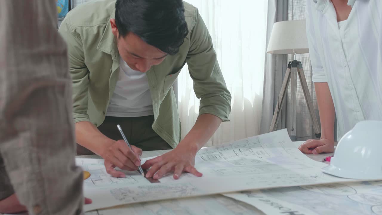 Group Of Asian Engineers Celebrating While Working At The Office