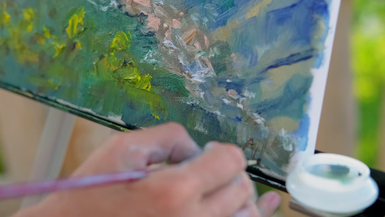 artista pintando un paisaje