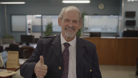 thumbs up from a police captain in a station