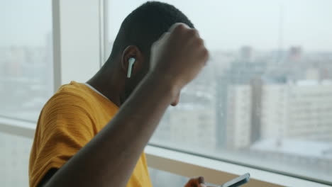 happy young man listening to music