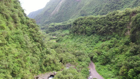 aerial flight down a valley away from grand galet falls at the cascade langevin on the island of réunion