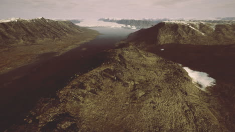 expansive view of rugged mountains and glacial landscapes at dawn