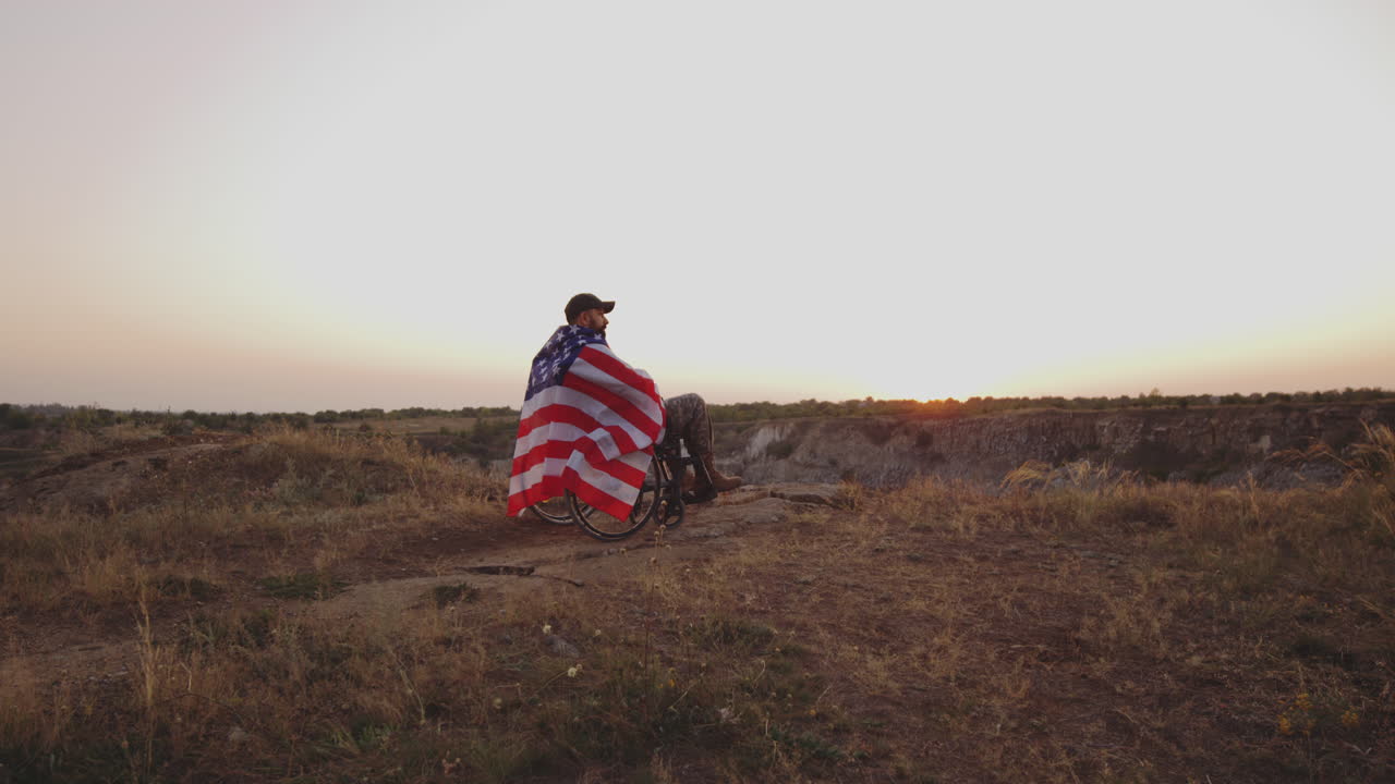 Disabled Veteran Reflecting at Sunset