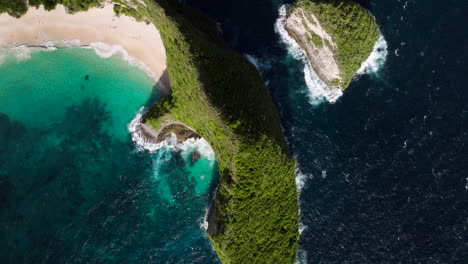 kelingking beach with calm blue waters in summer in nusa penida island, bali, indonesia