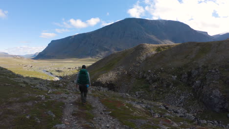 male hiker walking in the nature of northern sweden