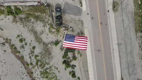 top view of horizontal us flag billowing with the wind on a sunny day