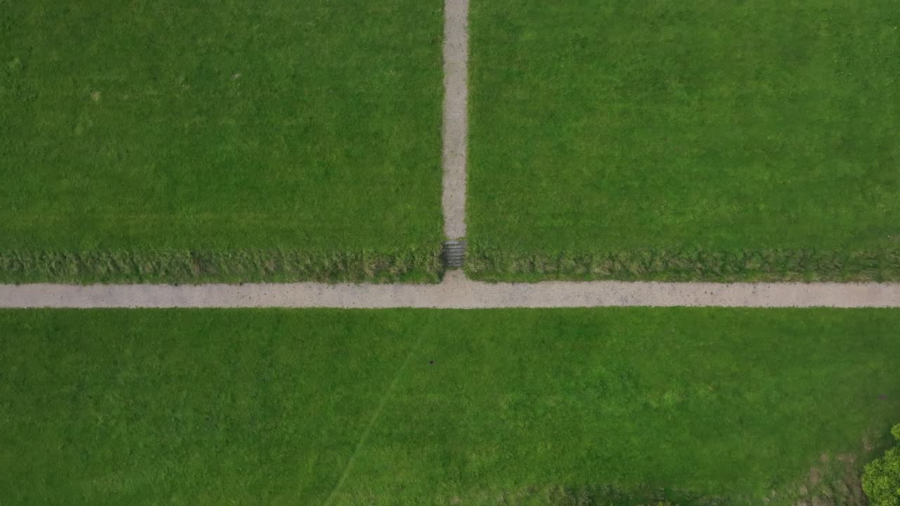 Castle Saunderson, County Cavan, Ireland, September 2022. Drone in Bird's Eye View tracks over the old ruined castle surrounded by green grass and lush trees.