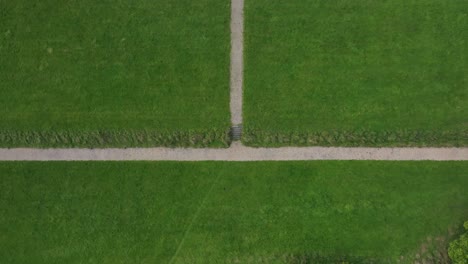castle saunderson, county cavan, ireland, september 2022. drone in bird's eye view tracks over the old ruined castle surrounded by green grass and lush trees.