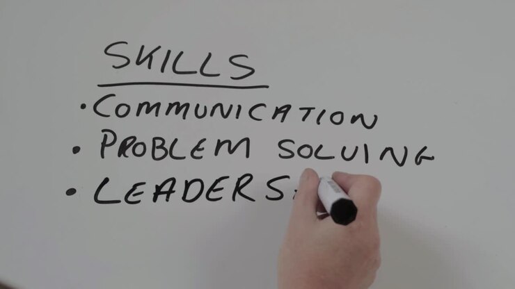 Hand writing skills list on a whiteboard