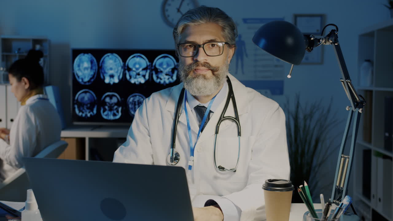 Doctor working late at night in a hospital office.