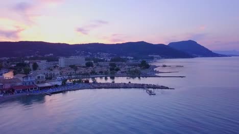 greece, corfu island, drone footage of a beautiful sunset over messonghi beach