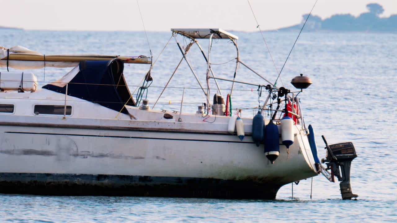 Antibes, France - February 14, 2025: White boat docked on the sea on a cloudy day