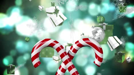 Animation-of-candy-canes,-christmas-boubles-and-presents-and-snow-falling-over-green-background