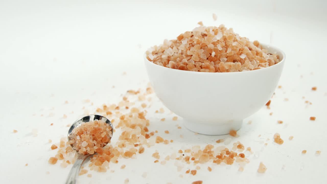Sea salt in bowl and spoon 4k