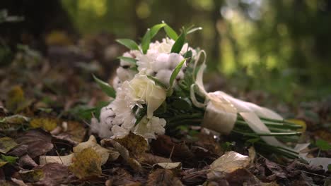 beautiful wedding bouquet lies on the leaves