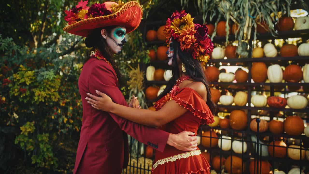Couple Dancing in Day of the Dead Costumes