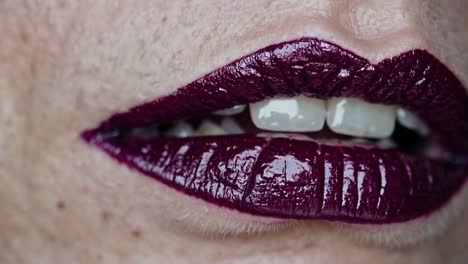 close-up of woman's lips with burgundy lipstick