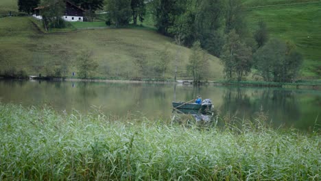 one relaxed adult man sitting on boat on lake pond