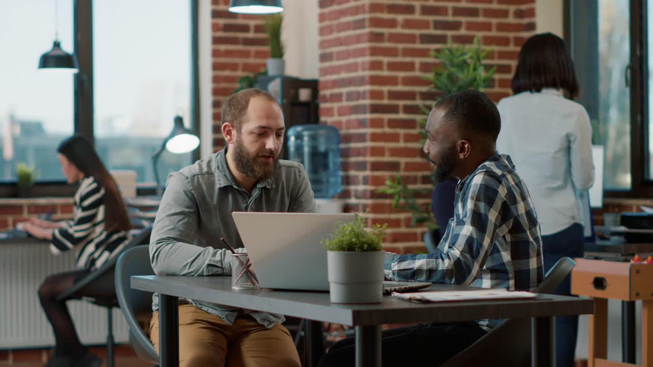 HR recruiter greeting male candidate at job interview application