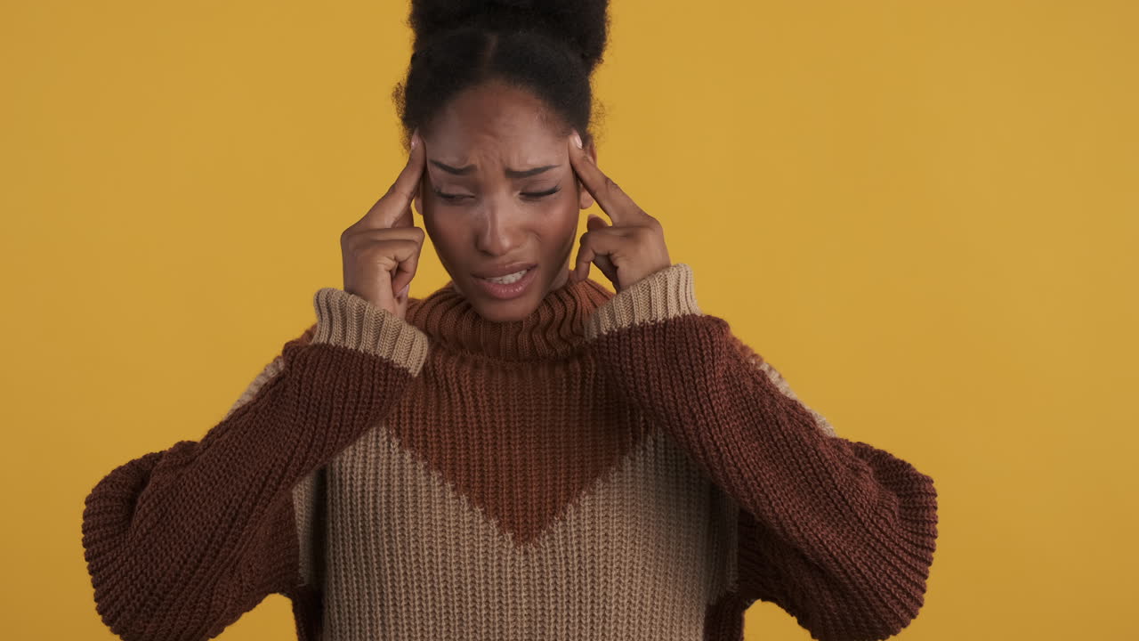 Worried woman feeling sick because of headache