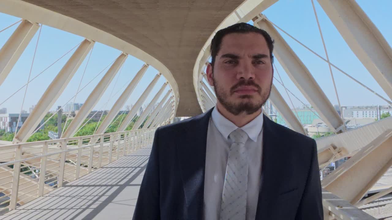 Confident Middle Eastern Businessman in a Suit Looking Directly at the Camera