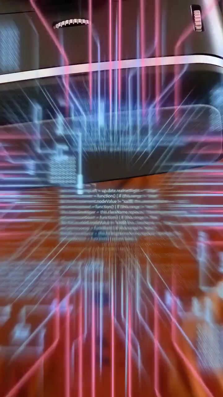 Vertical video: Woman leaning at laptop starting overlay demoing VR code flowing over for tech demo