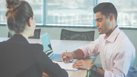 animation of statistical data processing against diverse man and woman discussing at office