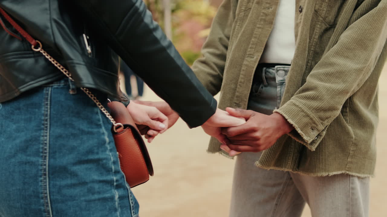 Close-up of Two People Holding Hands