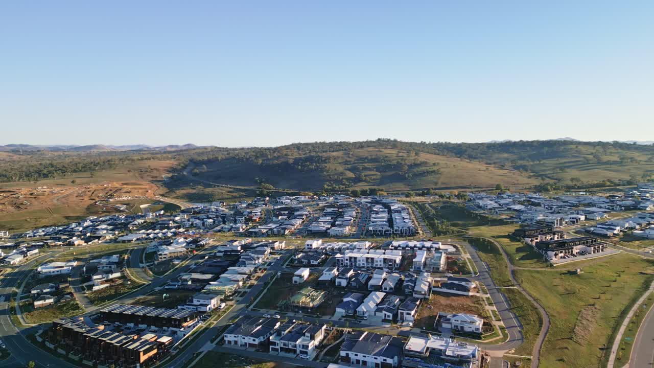 Drone footage showcasing the expansion of a new residential area in Whitlam, Canberra, highlighting modern housing developments and urban planning.