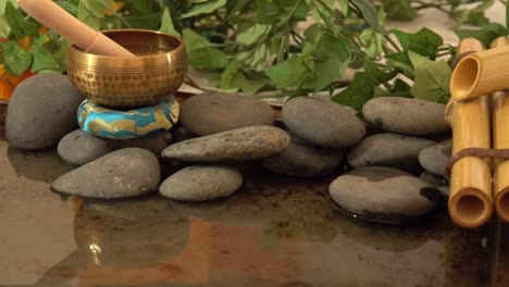 tibetan bell on a pond of water with a fountain