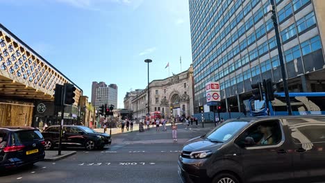 vehicles passing by waterloo station in london