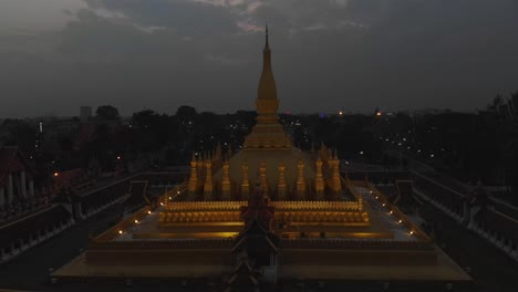 wide shot of pha that luang temple vientiane laos in blue hour, aerial