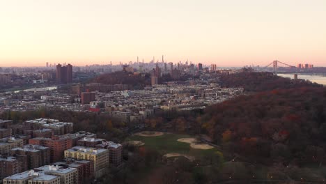 Aerial-rise-over-Inwood-Park-looking-downtown-to-The-Heights-and-Harlem-and-Midtown