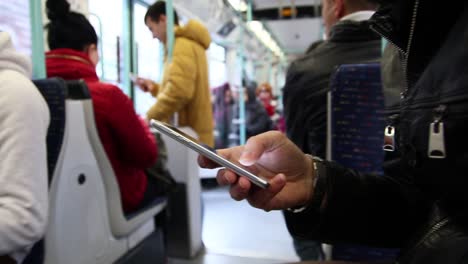 Messaging-On-The-Smartphone-Inside-Of-Subway