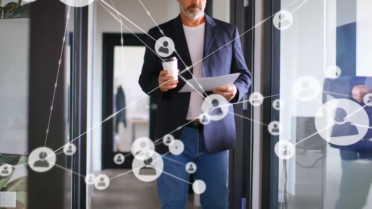Animation of network of connections icons over caucasian businessman with documents