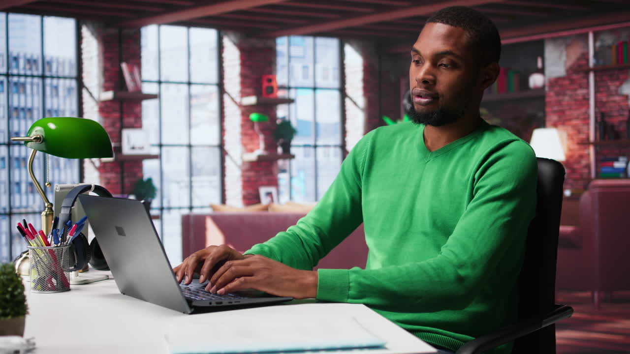 Vertical Video Man at home deals with back pain and stretching joints on chair