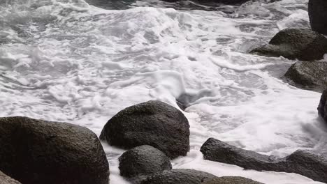 dynamic waves crashing against coastal rocks