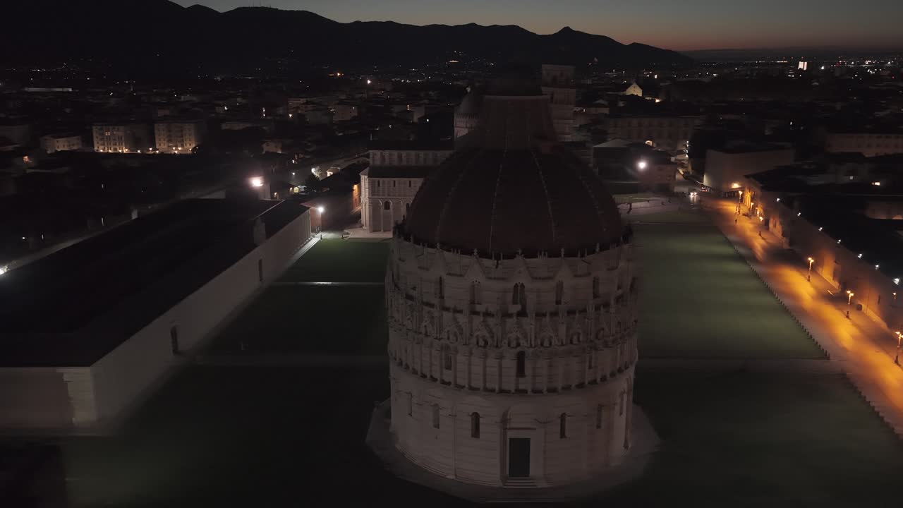 Cinematic sunrise drone footage of the Leaning Tower of Pisa and the Piazza dei Miracoli, captured with smooth aerial movements and soft early morning light