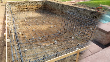4k Looping Seamless Cinemagraph of Swimming Pool Construction Fading to Completed Pool