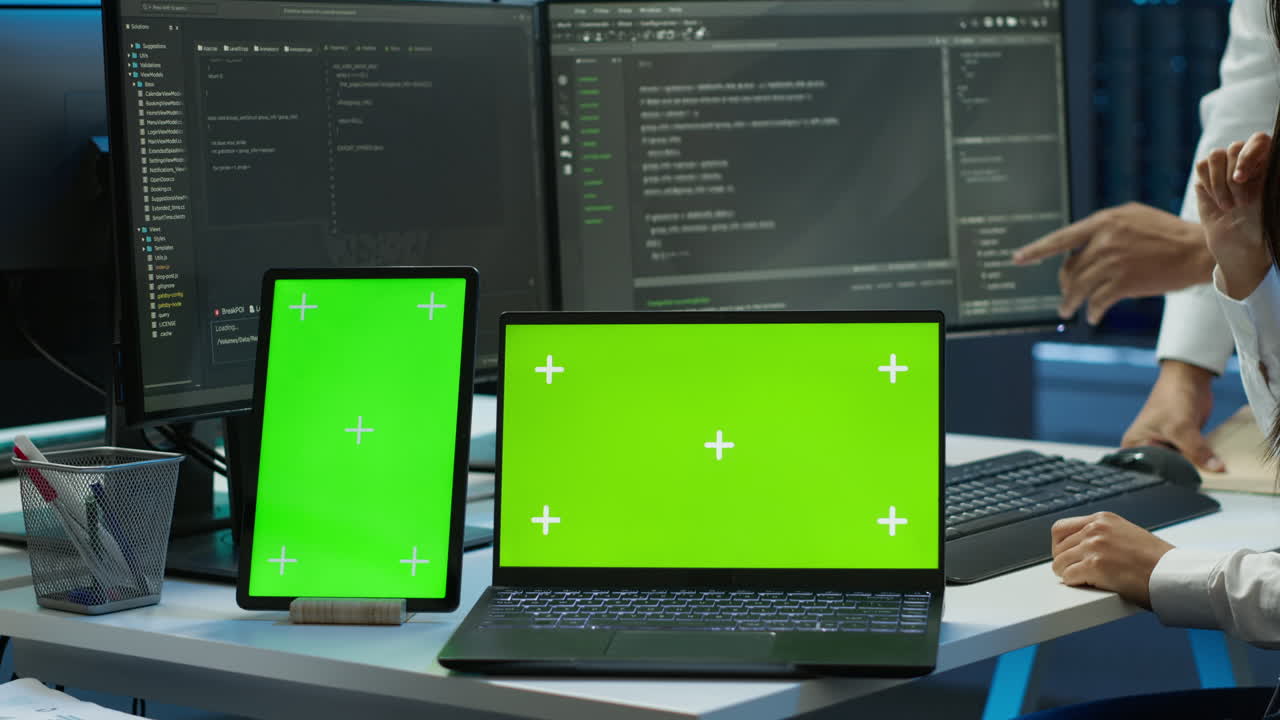 Employee using green screen devices in server farm used for automation